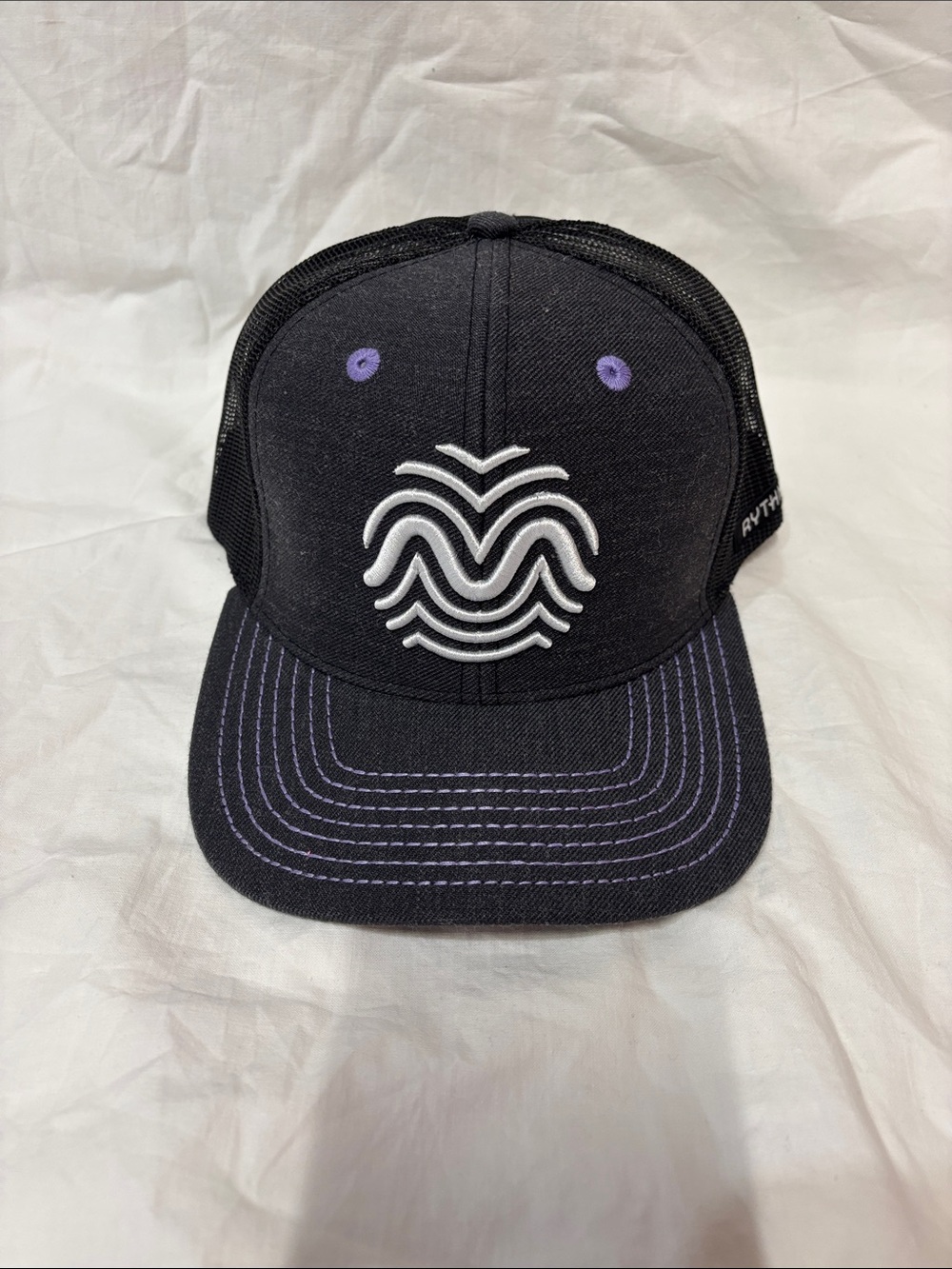 Black rhythm trucker hat